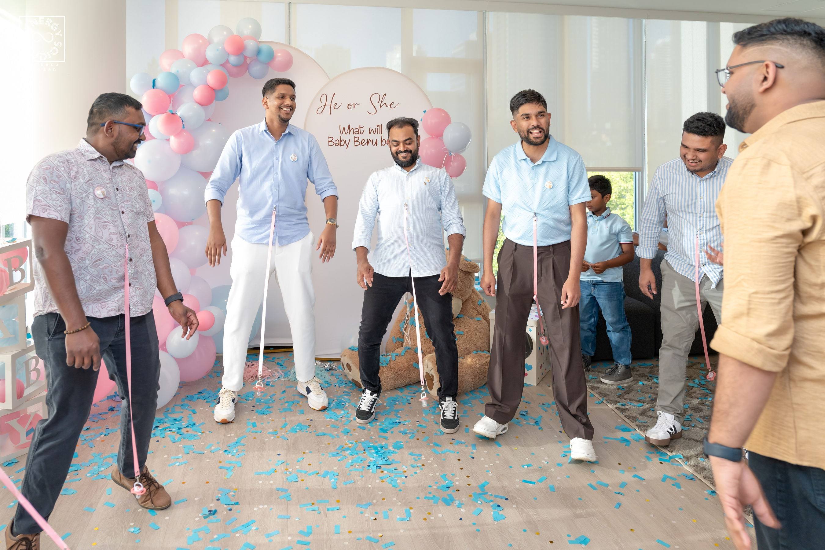Guests dancing and celebrating at a gender reveal party