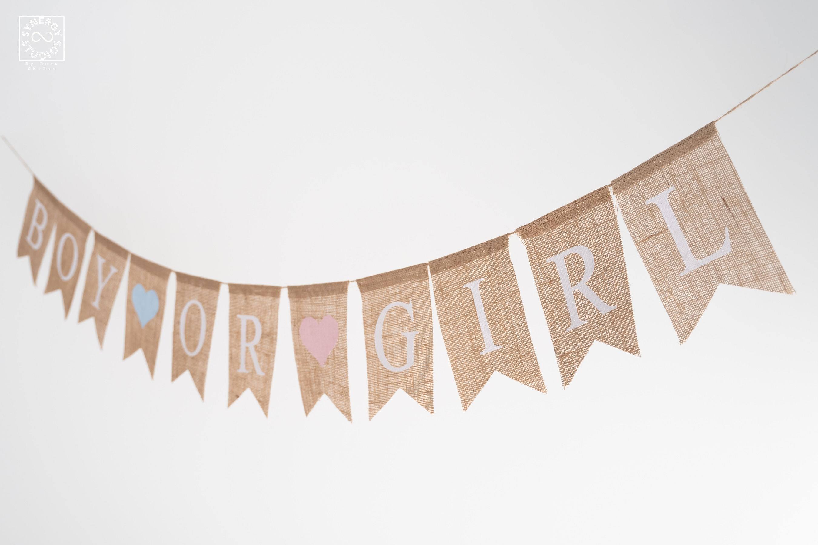 Hessian "boy or girl" bunting hanging against a white wall