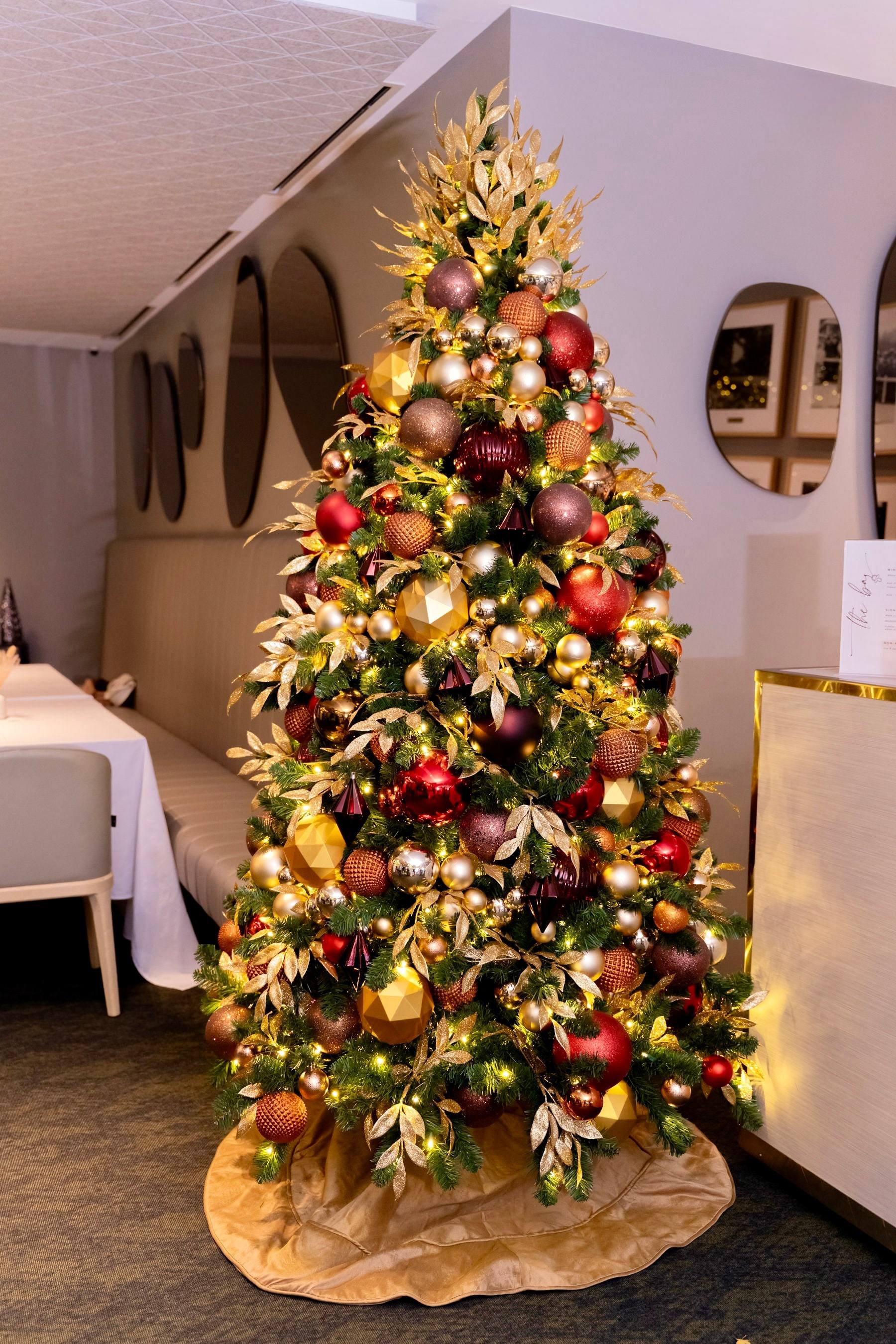 Decorated Christmas tree at a winter baby shower venue