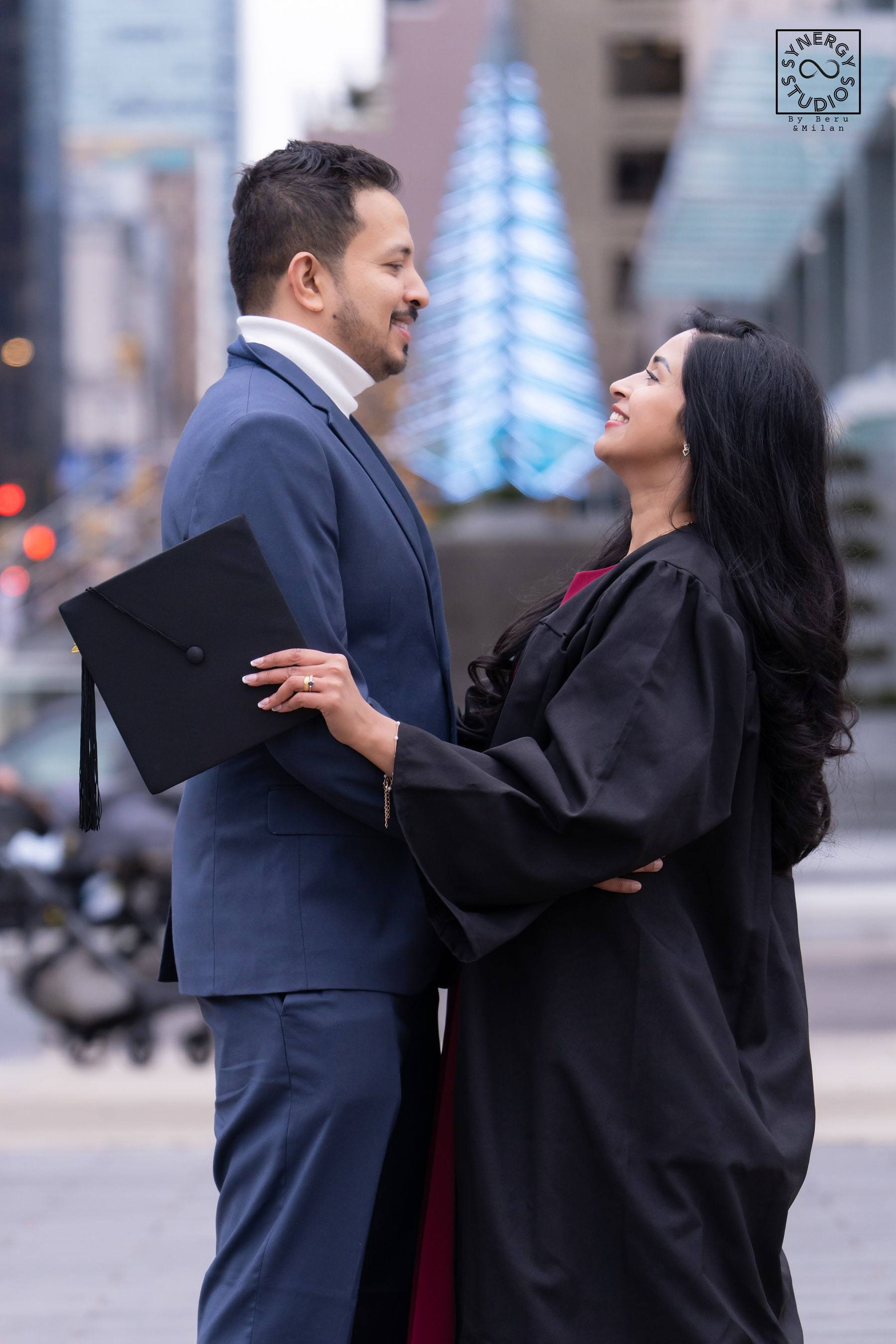 Graduate and her husband sharing a moment on a city street